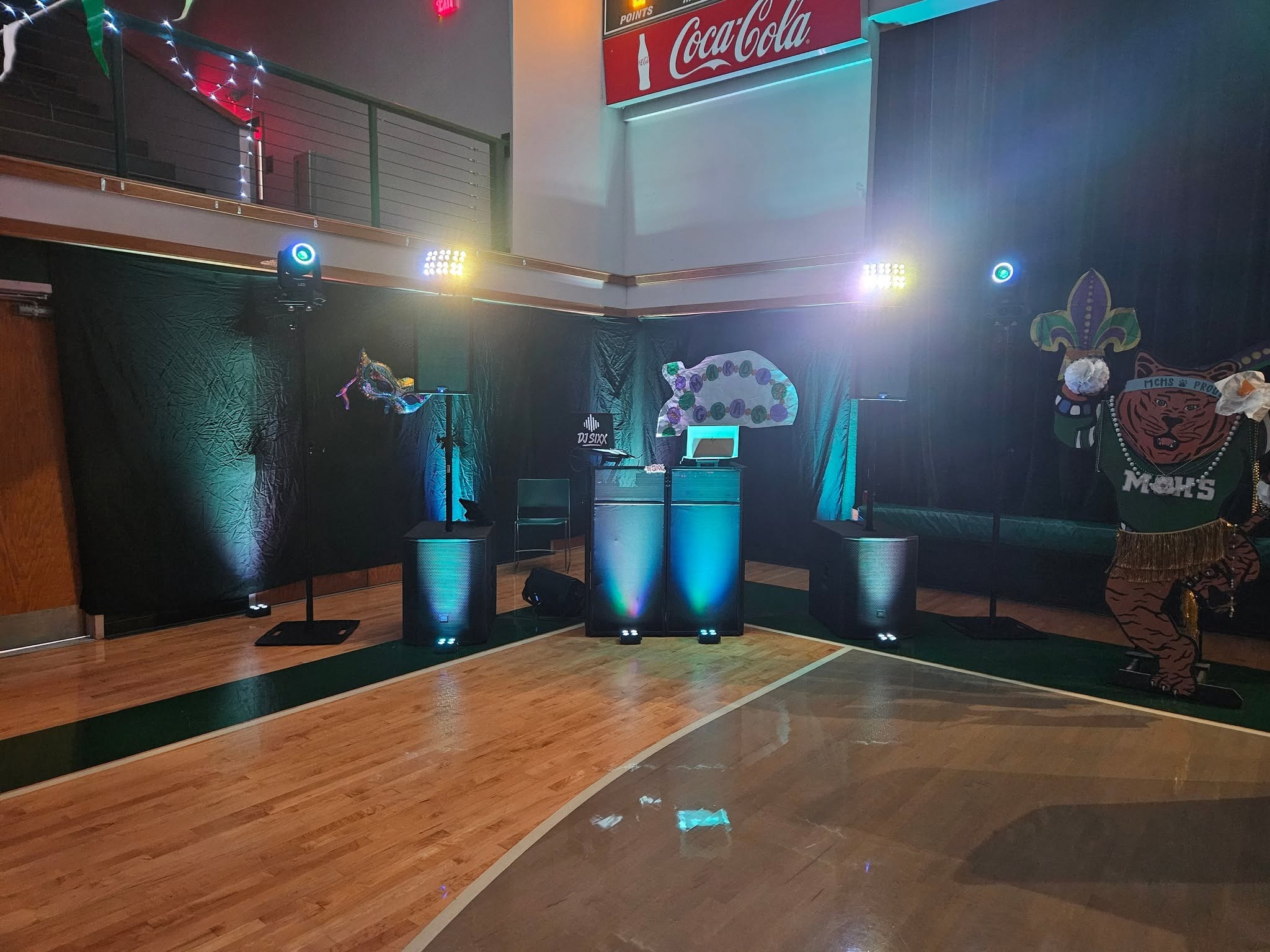 ESM event sound and lighting setup with illuminated DJ booth